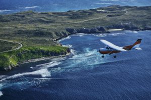 Aerial view of Rottnest Air Taxi flying high over the island.