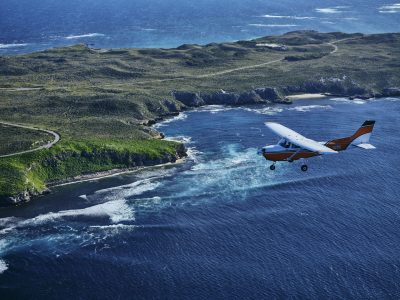 Aerial view of Rottnest Air Taxi flying high over the island.